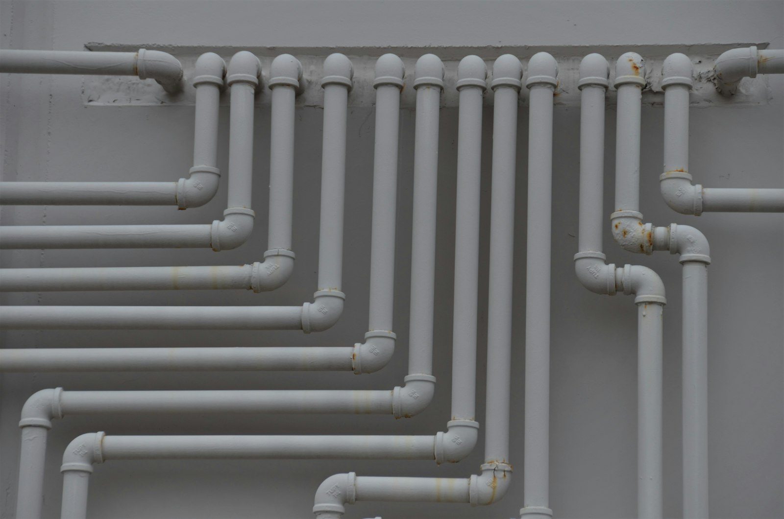 Clean pipe runs on a wall
